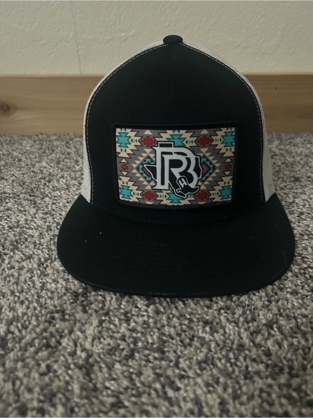 Black Trucker Hat with Aztec Patch
